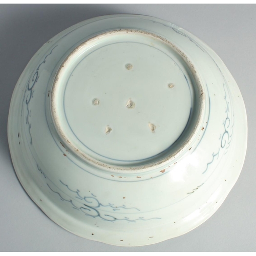 97 - A LARGE CHINESE BLUE AND WHITE PORCELAIN BOWL, painted with flora, 31.5cm diameter.