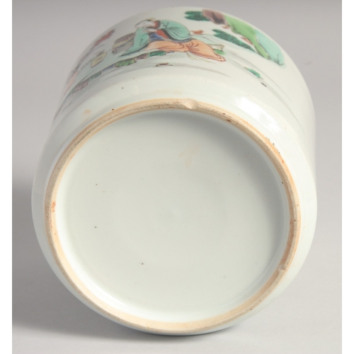 38 - A CHINESE FAMILLE VERTE PORCELAIN BRUSH POT, painted with figures in an outdoor setting, 14cm high.