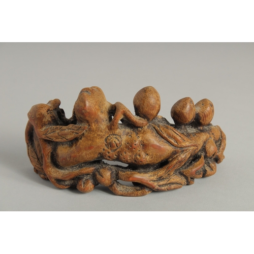 39 - A CHINESE CARVED BAMBOO BRUSH STAND, 16.5cm long.