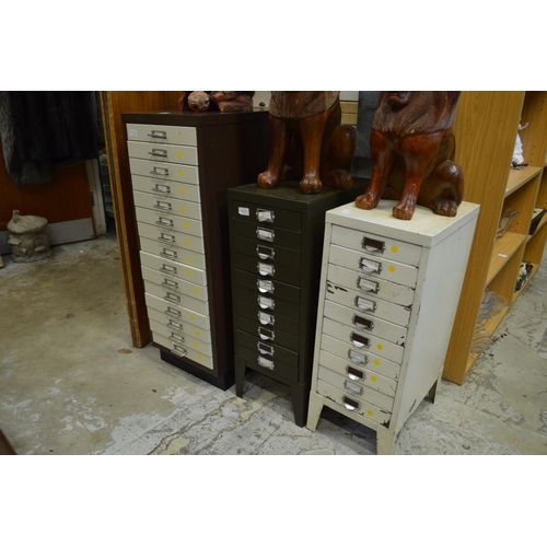 10 - Three metal multi-drawer filing cabinets.