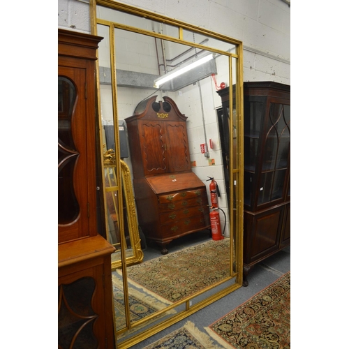 1010 - A GOOD LARGE GILT FRAMED RECTANGULAR MIRROR.  7ft 6ins x 4ft 6ins.