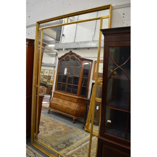 1010 - A GOOD LARGE GILT FRAMED RECTANGULAR MIRROR.  7ft 6ins x 4ft 6ins.