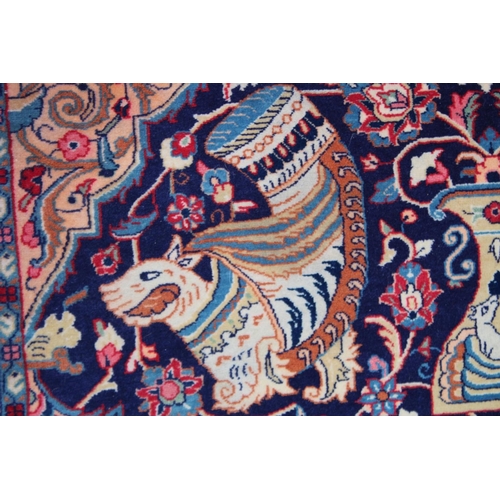 1014 - AN UNUSUAL PERSIAN CARPET, rich ground and deep red border, all with Persian and Islamic bowls, vase... 