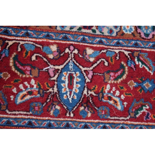 1017 - A GOOD PERSIAN CARPET, cream ground with all over floral decoration.  9'6