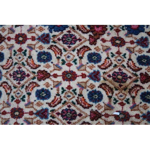 1017 - A GOOD PERSIAN CARPET, cream ground with all over floral decoration.  9'6