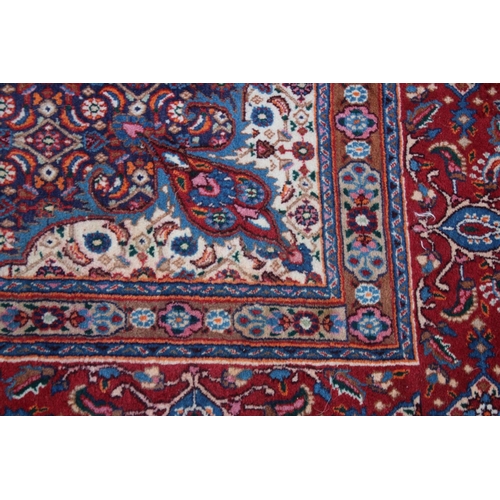 1017 - A GOOD PERSIAN CARPET, cream ground with all over floral decoration.  9'6