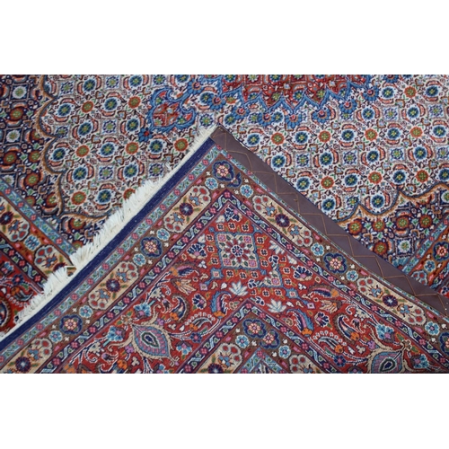 1018 - A GOOD PERSIAN CARPET, cream ground with stylised all over floral decoration.  8' x 6'5