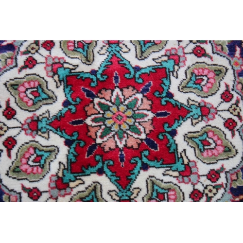 1019 - A GOOD LARGE PERSIAN CARPET, crimson ground with floral decoration in a similar blue ground border. ... 