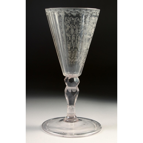 1022 - AN 18TH - 19TH CENTURY GERMAN GLASS with facet stem, the bowl engraved with a deer hunt. 7.25ins hig... 