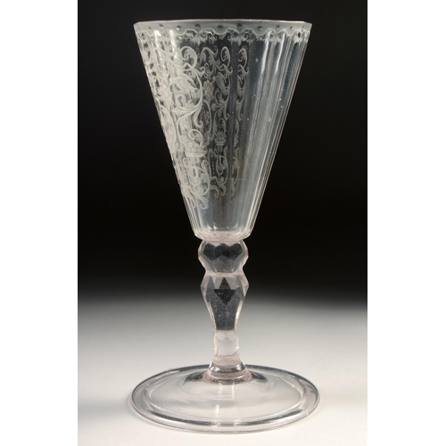 1022 - AN 18TH - 19TH CENTURY GERMAN GLASS with facet stem, the bowl engraved with a deer hunt. 7.25ins hig... 