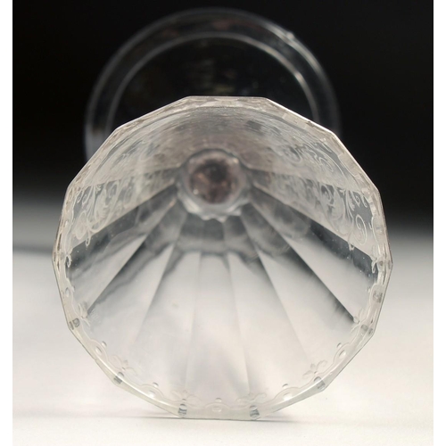 1022 - AN 18TH - 19TH CENTURY GERMAN GLASS with facet stem, the bowl engraved with a deer hunt. 7.25ins hig... 