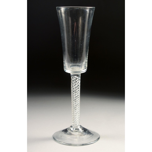 1023 - AN 18TH CENTURY TALL PLAIN ALE GLASS with air twist stem. 7.75ins high.