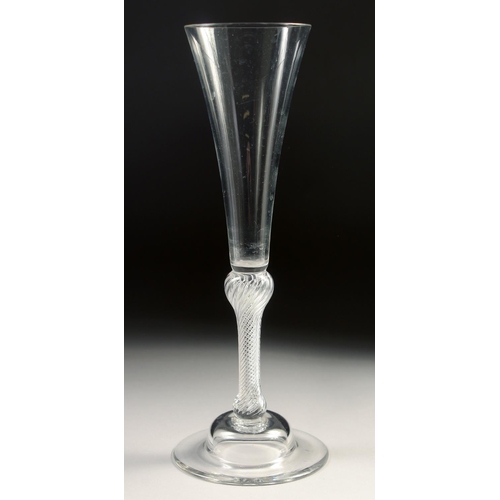 1024 - AN 18TH CENTURY TALL PLAIN ALE GLASS with air twist stem. 7.75ins high.