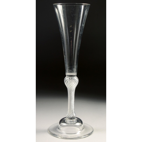 1024 - AN 18TH CENTURY TALL PLAIN ALE GLASS with air twist stem. 7.75ins high.