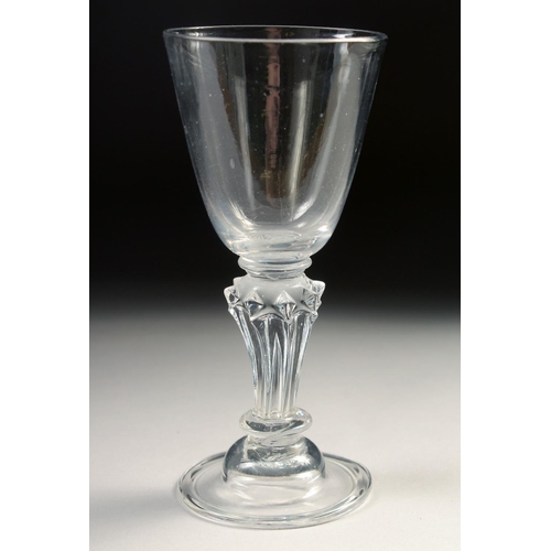 1029 - AN 18TH CENTURY WINE GLASS with pedestal stem. 5.75ins high.