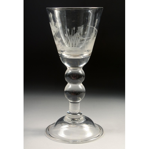 1030 - A LARGE WINE GLASS, the bowl engraved with two men fishing. 7.5in