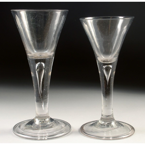 1031 - TWO 18TH CENTURY WINE GLASSES with tapering bowls and teardrop stems. 6ins and 5.5ins high.