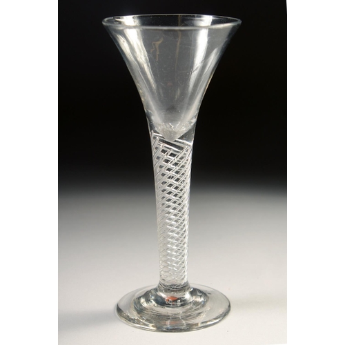 1033 - AN 18TH CENTURY TAPERING WINE GLASS with air twist stem. 6ins high.