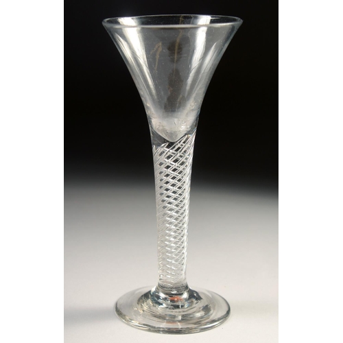 1033 - AN 18TH CENTURY TAPERING WINE GLASS with air twist stem. 6ins high.