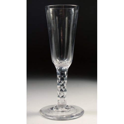 1036 - AN 18TH CENTURY DUTCH WINE GLASS with facet stem and plain bowl. 6.75ins high.