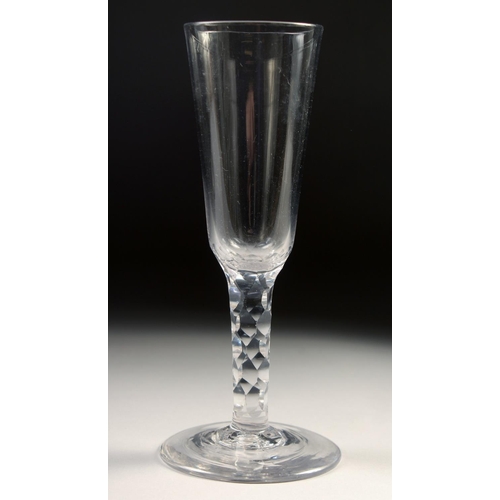 1036 - AN 18TH CENTURY DUTCH WINE GLASS with facet stem and plain bowl. 6.75ins high.