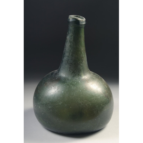 1038 - A MID 17TH CENTURY DUTCH GREEN GLASS ONION BOTTLE, deep painted base.