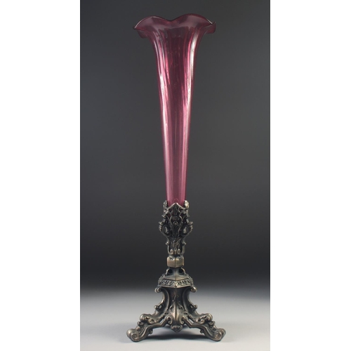 1040 - A 19TH CENTURY TALL TAPERING GLASS CENTREPIECE with cast metal base. 24ins high.