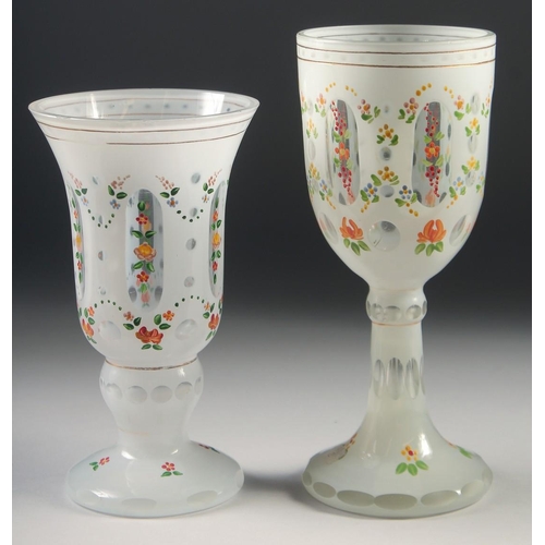 1045 - TWO BOHEMIAN GLASS GOBLETS painted with flowers. 8ins & 7ins high.