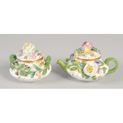 1061 - A 19TH CENTURY ENGLISH PORCELAIN MINIATURE FLORAL ENCRUSTED TEAPOT AND COVER AND A MATCHING SUCRIER ... 