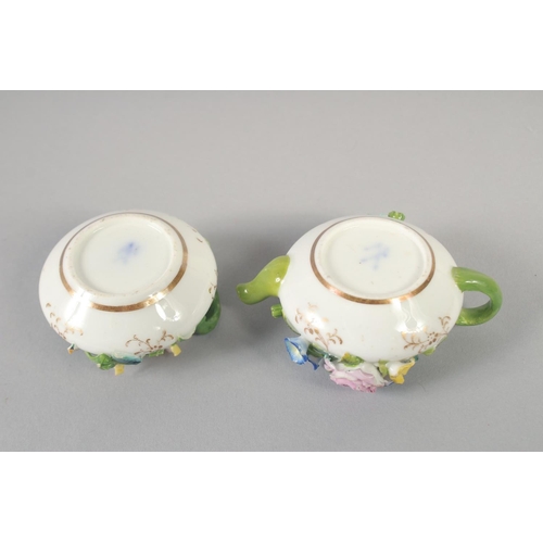 1061 - A 19TH CENTURY ENGLISH PORCELAIN MINIATURE FLORAL ENCRUSTED TEAPOT AND COVER AND A MATCHING SUCRIER ... 