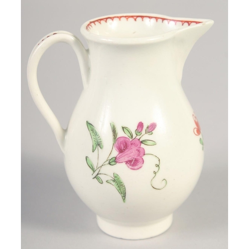 1065 - AN 18TH CENTURY WORCESTER JUG painted with a rose and rose bud with internal line and loop border.