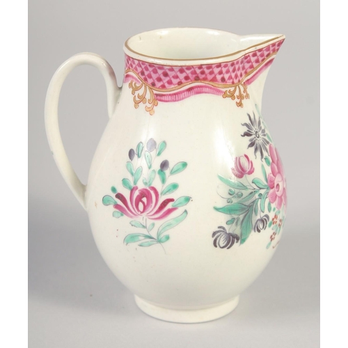 1069 - AN 18TH CENTURY WORCESTER JUG painted with flowers and an internal pink diaper border.