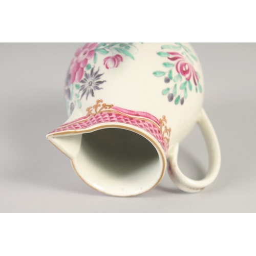 1069 - AN 18TH CENTURY WORCESTER JUG painted with flowers and an internal pink diaper border.