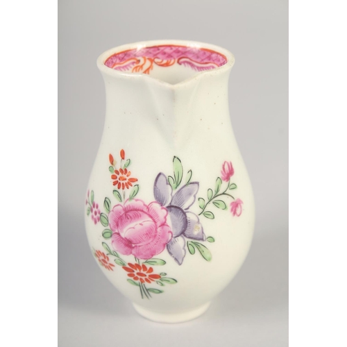 1070 - AN 18TH CENTURY WORCESTER JUG painted with flowers and an internal pink diaper border.