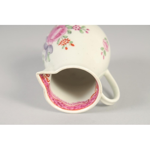 1070 - AN 18TH CENTURY WORCESTER JUG painted with flowers and an internal pink diaper border.