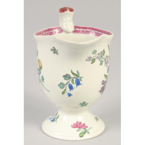 1071 - An 18TH CENTURY LIVERPOOL JUG painted with scattered spray and sprigs of flowers with internal pink ... 