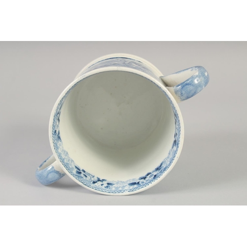 1082 - A STAFFORDSHIRE TWO HANDLED LOVING CUP printed with a farm scene