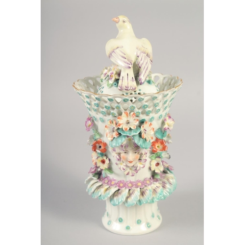 1088 - AN 18TH OR 19TH CENTURY VASE AND COVER with bird finial encrusted with flowers and face-mask handles... 