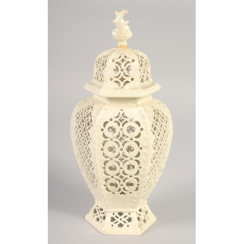 1089 - A LATE 19TH CENTURY LEEDS CREAMWARE VASE AND COVER, the body having alternating pierced panels.