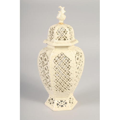 1089 - A LATE 19TH CENTURY LEEDS CREAMWARE VASE AND COVER, the body having alternating pierced panels.