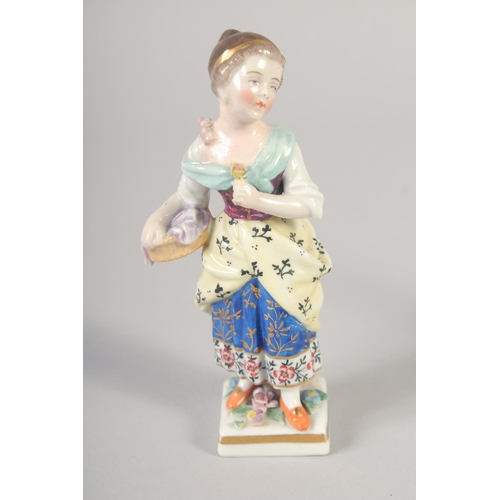 1095 - A 19TH CENTURY STAFFORDSHIRE PORCELAIN FIGURE OF A GIRL wearing a hat. and A PAIR OF CONTINENTAL FIG... 