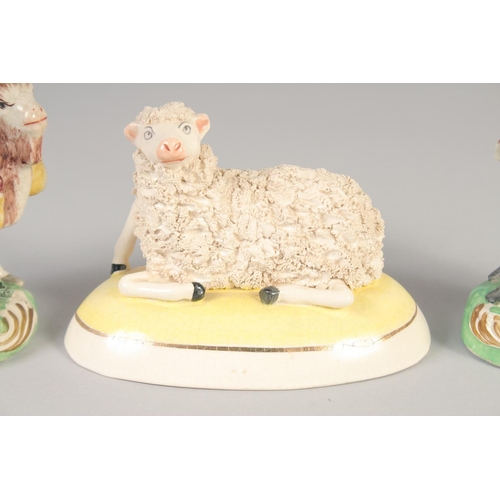 1096 - A 19TH CENTURY STAFFORDSHIRE FIGURE OF THE WELSH TAILOR AND COMPANION together with a later sheep.