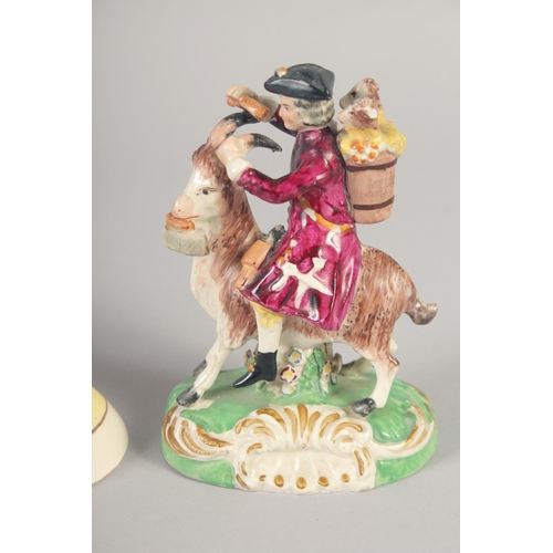 1096 - A 19TH CENTURY STAFFORDSHIRE FIGURE OF THE WELSH TAILOR AND COMPANION together with a later sheep.