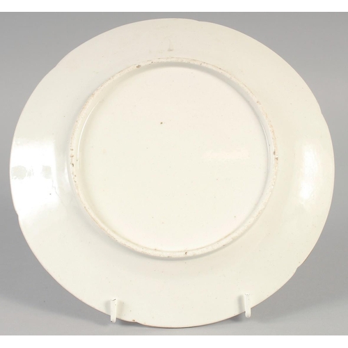 1098 - AN 18TH CENTURY ENGLISH PORCELAIN PLATE painted with a stately residence.