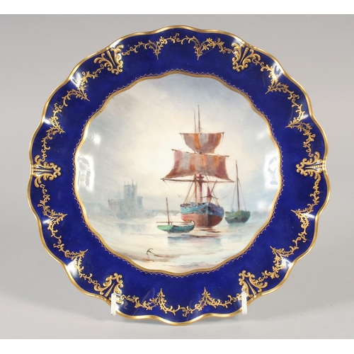 1108 - A ROYAL CROWN DERBY FINE SCALLOPED EDGE PLATE painted in colour with a ship at anchor and a castle i... 