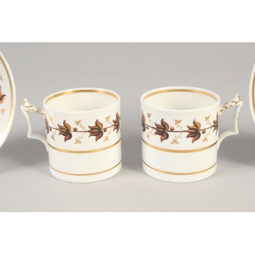 1112 - A FLIGHT BARR PAIR OF COFFEE CANS AND SAUCERS painted with brown leaves and a Barr Flight and Barr b... 