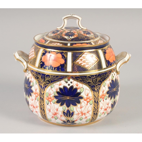 1113 - A ROYAL CROWN DERBY LARGE TWO HANDLED COVERED JAR painted in pattern 1128, date mark 1925.