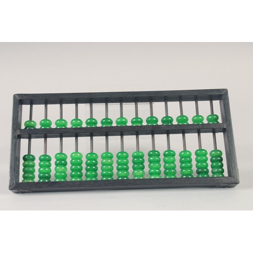 1135 - A HARDWOOD ABACUS, with green stone beads.