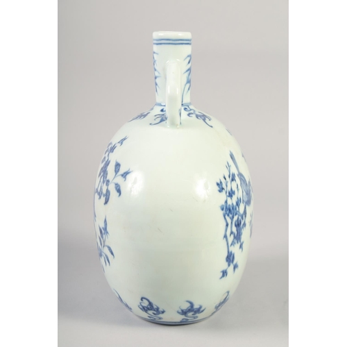 1140 - A CHINESE BLUE AND WHITE PORCELAIN MOON FLASK with twin handles and decorated with birds. 28cm high.... 