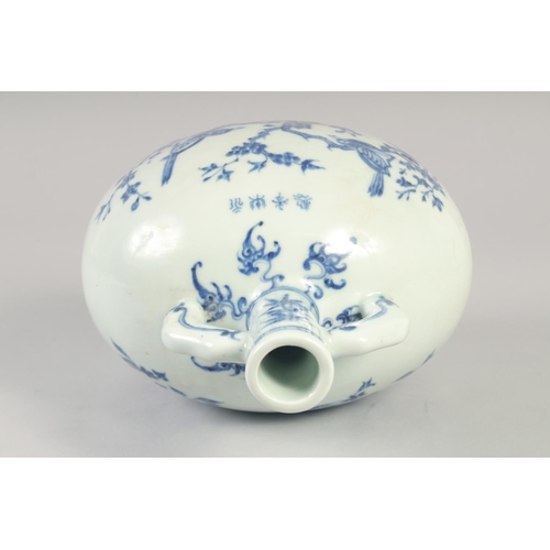 1140 - A CHINESE BLUE AND WHITE PORCELAIN MOON FLASK with twin handles and decorated with birds. 28cm high.... 